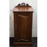 A Victorian walnut pot cupboard.