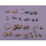 A quantity of various gold and other earrings.