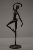 A Hagenauer style bronze model of a ballerina. 27 cm high.