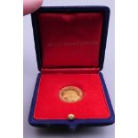 A 22 ct gold RAF Battle of Britain 25th Anniversary coin, boxed. 3.5 grammes.