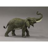 A cold painted bronze model of an elephant. 34 cm long.