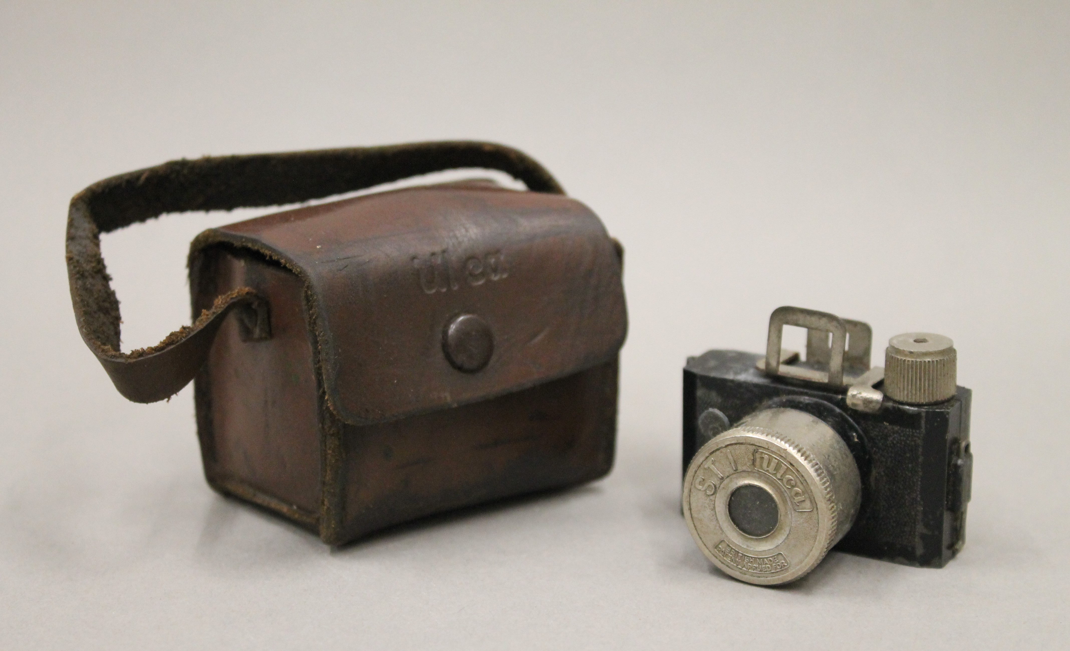 A small quantity of silver plate, an 830 silver spoon and a miniature camera. - Image 2 of 2