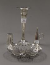 A silver bud vase, a silver candle snuffer,