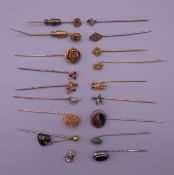 A collection of various gold and other stick pins.