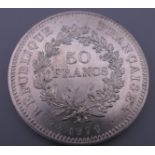 A French silver coin, cased.