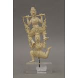 A late 19th/early 20th century Indian ivory carving of dancers mounted on a later plinth base.