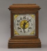 An Ansonia oak mantle clock. 24 cm wide.