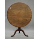 A 19th century mahogany tilt top tripod table. 90 cm diameter.