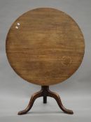 A 19th century mahogany tilt top tripod table. 90 cm diameter.