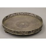 A Chinese silver tray, with maker's mark for Wan Hing. 21 cm diameter. 451.4g.