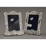 A pair of silver photograph frames. 20.5 cm high.
