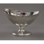 A silver footed bon-bon dish of navette form with swing handle. 14.5 cm wide. 148.3 grammes.