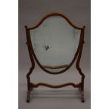 A Victorian inlaid mahogany shield shape dressing table mirror. 53.5 cm wide.