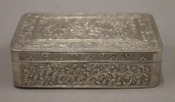 A 19th century Chinese silver box engraved with figures and trees, etc., seal marks to base.