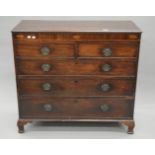 A George III mahogany inlaid chest of drawers. 111 cm wide.