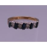 A 9 ct gold sapphire ring. Ring size M/N. 2.4 grammes total weight.