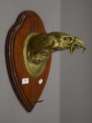 A bronze eagle form gong hanger by Thong mounted on an oak shield and with associated gong.