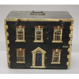 A 19th century pine box painted as a house. 36.5 cm wide.