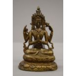 An 18th/19th century Sino Tibetan four-armed deity. 14.5 cm high.