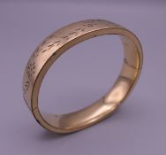 A Kestenmade USA rolled gold bangle. 6.5 cm diameter.