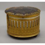 A 19th century French cylindrical music box with tortoiseshell lid. 8.5 cm high.