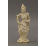 A late 19th/early 20th century Indian carved ivory model of a woman. 12 cm high.