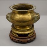 A Chinese bronze censer on stand. 14 cm high.