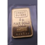 A Credit Swiss fine gold 5 gram ingot in blue Credit Swiss box.