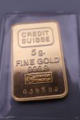 A Credit Swiss fine gold 5 gram ingot in blue Credit Swiss box.