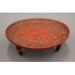 A 19th century Chinese cinnabar lacquer three legged dish. 17.5 cm diameter.