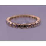 An 18 ct gold diamond full eternity ring. Ring size I/J. 1.8 grammes total weight.