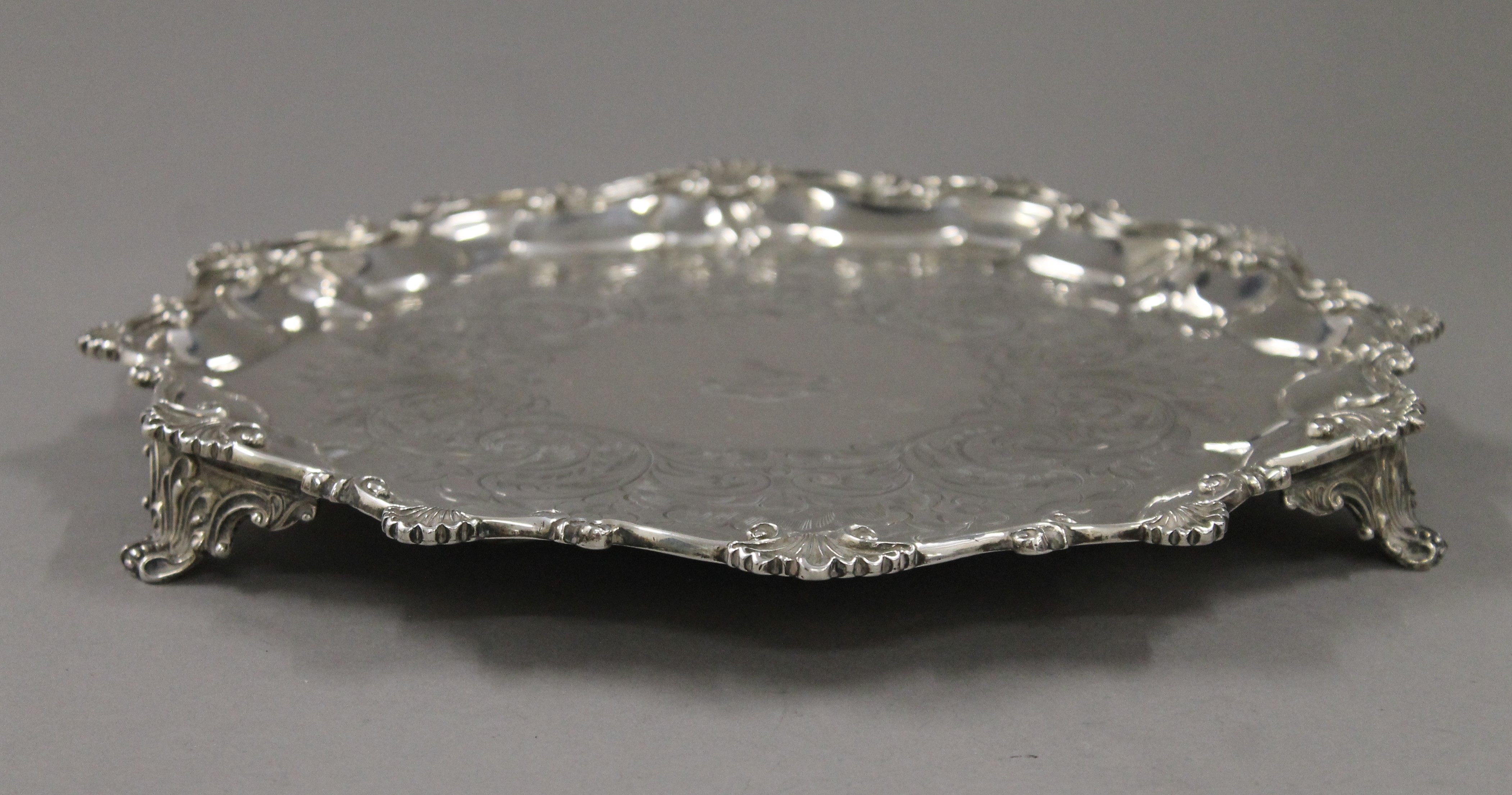 A Victorian engraved silver salver. 30 cm wide. 784.1 grammes. - Image 2 of 7