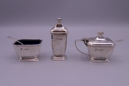 A silver three-piece cruet set retailed by Harrod's. 125.6 grammes.