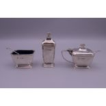 A silver three-piece cruet set retailed by Harrod's. 125.6 grammes.