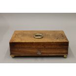 A small 19th century inlaid mahogany box. 22 cm wide.