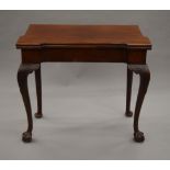 An 18th century mahogany folding card table,