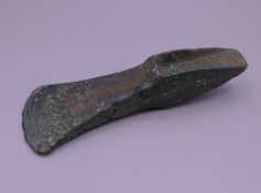A Bronze Age palstave axe head found in North Norfolk. 15 cm long.