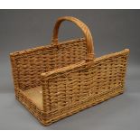 A log basket. 57 cm long.