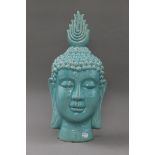 A blue porcelain Buddha head. 50 cm high.