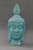 A blue porcelain Buddha head. 50 cm high.