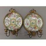 A pair of 19th century ormolu mounted Canton famille rose plates,