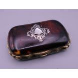 A Victorian silver and tortoiseshell purse lined with silk. 7.5 cm wide.