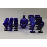 A quantity of Bristol blue glassware, including decanter, ewer and various drinking glasses.