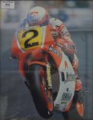 Four motorcycling interest framed photographs/prints, including Suzuki, Yamaha and Barry Sheene.