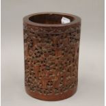 A 19th century Chinese carved bamboo brush pot. 17.5 cm high.