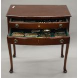 A fitted mahogany canteen table of silver cutlery, comprising: 12 dessert forks, 12 table forks,