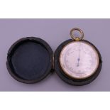 A Victorian leather cased pocket barometer.