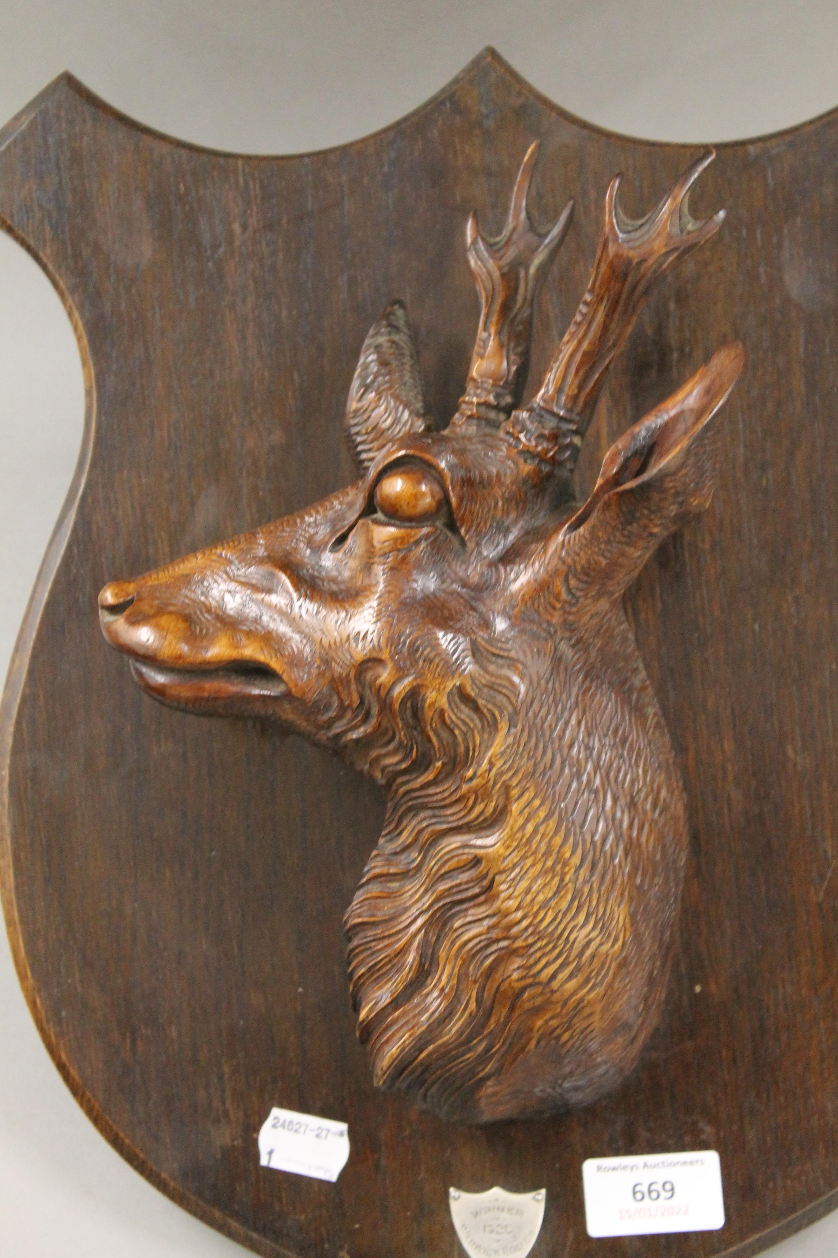 A pair of carved 1920's stag head trophy shields. 37 cm high. - Image 3 of 7