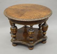 A mid-20th century carved coffee table. 80 cm diameter.