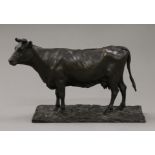 A bronze model of a cow. 27 cm long.